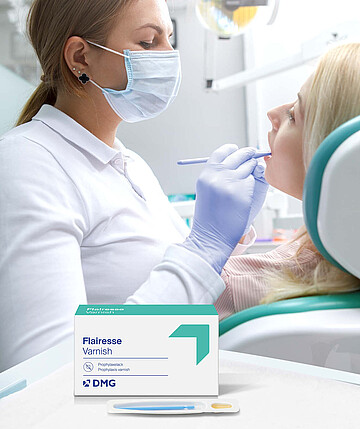 Flairesse Varnish with packaging and a dentist treating a patient in the background. 